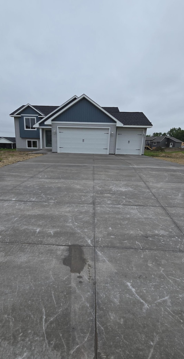 230 Eagle Ridge Dr, Roberts, WI 54023 - view of front facade with driveway and an attached garage