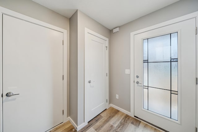 230 Eagle Ridge Dr, Roberts, WI 54023 - doorway featuring light wood-type flooring and baseboards
