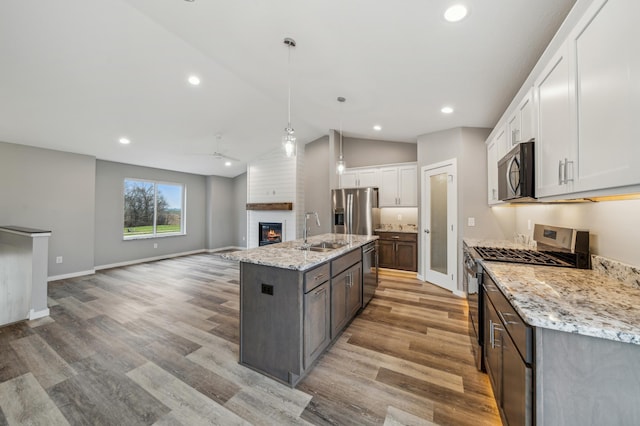 230 Eagle Ridge Dr, Roberts, WI 54023 - kitchen with appliances with stainless steel finishes, ceiling fan, open floor plan, light wood-type flooring, and recessed lighting