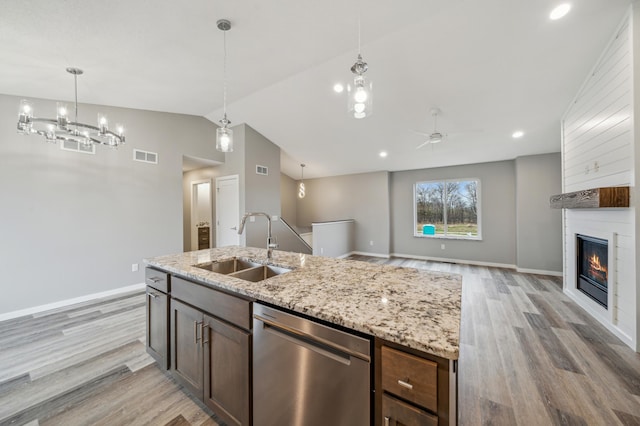 230 Eagle Ridge Dr, Roberts, WI 54023 - kitchen with stainless steel dishwasher, vaulted ceiling, light wood finished floors, open floor plan, and ceiling fan