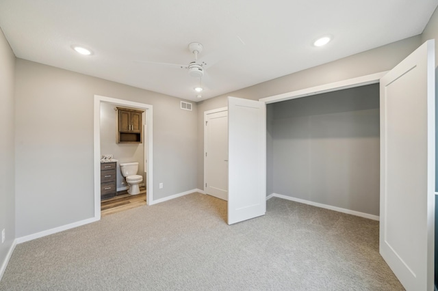 230 Eagle Ridge Dr, Roberts, WI 54023 - unfurnished bedroom featuring light colored carpet, recessed lighting, ensuite bath, and a ceiling fan