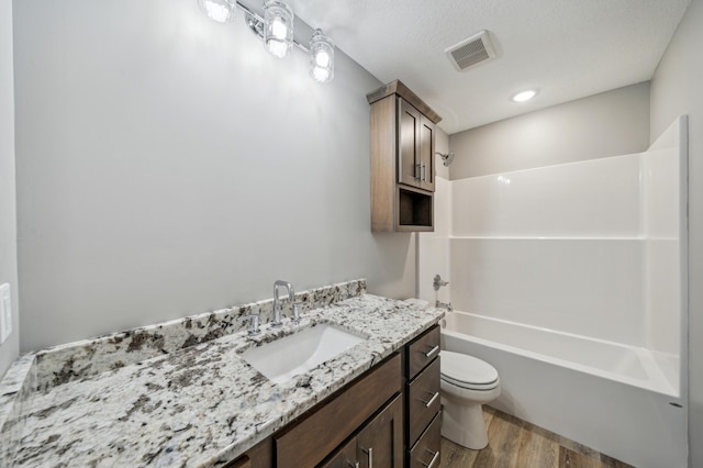 230 Eagle Ridge Dr, Roberts, WI 54023 - bathroom featuring wood finished floors, vanity, and shower / bathtub combination