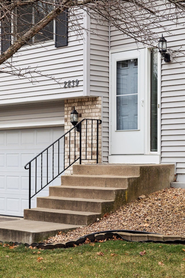 entrance to property featuring a garage