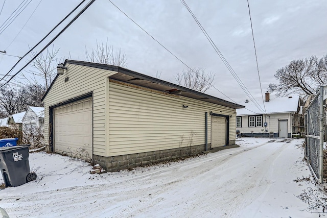 view of snow covered garage