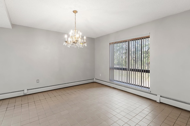 tiled spare room featuring a notable chandelier