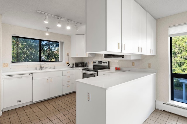 kitchen with white dishwasher, stainless steel electric stove, a baseboard heating unit, sink, and white cabinets