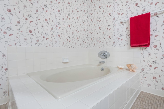 bathroom with tile patterned floors and tiled tub