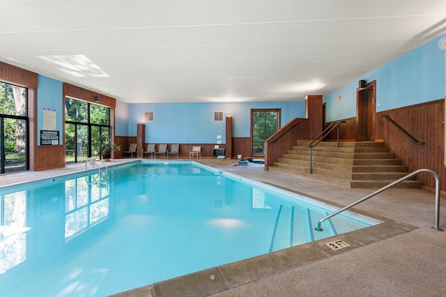 view of pool with a hot tub