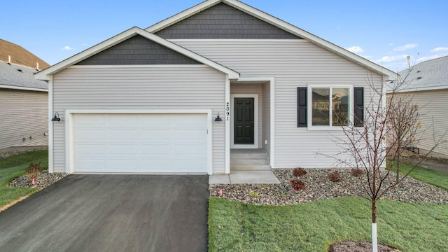 view of front facade with a front lawn and a garage