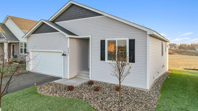 view of front facade with a front lawn and a garage