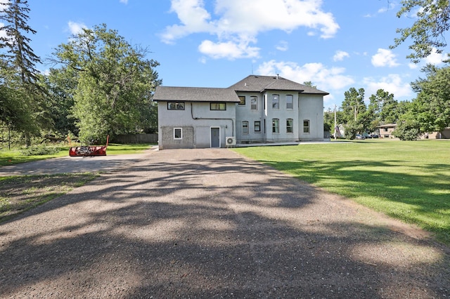 view of front of home with a front lawn