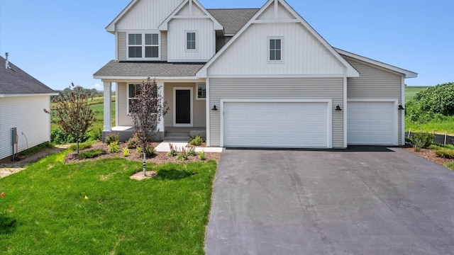 view of front of home with a garage and a front yard