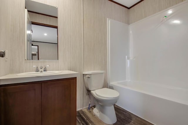 full bathroom with bathing tub / shower combination, vanity, wood-type flooring, and toilet