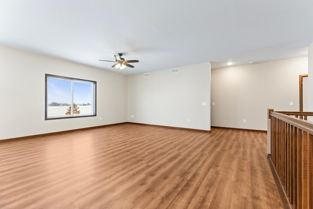 unfurnished room with light hardwood / wood-style floors and ceiling fan