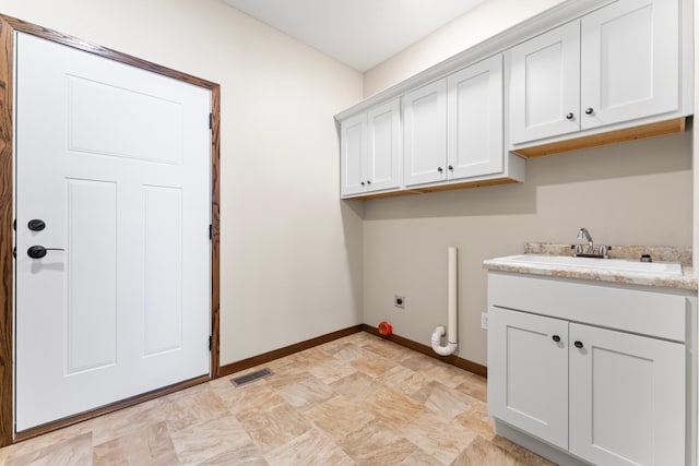 clothes washing area with sink, cabinets, and electric dryer hookup