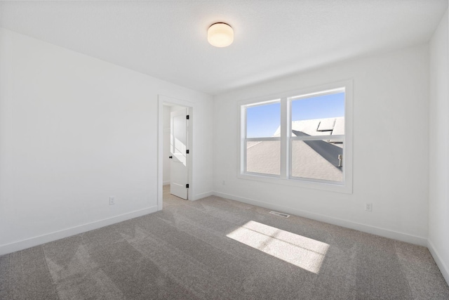 empty room featuring carpet flooring