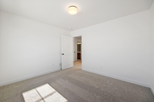 unfurnished room featuring carpet