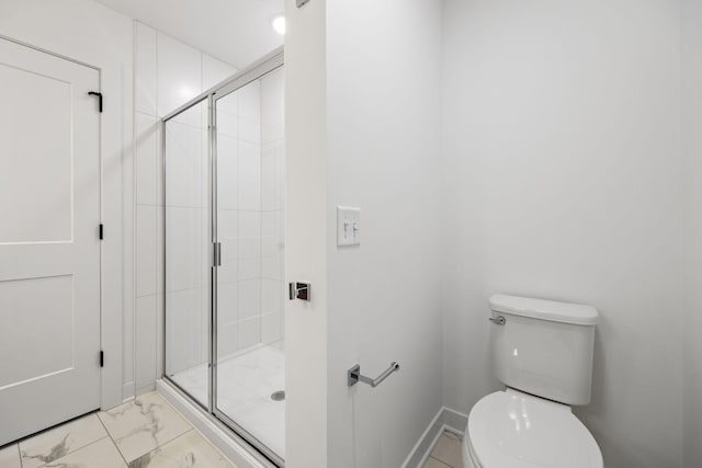 bathroom with toilet and an enclosed shower