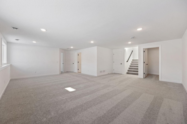 basement with light colored carpet