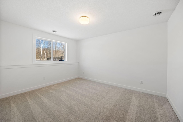 unfurnished room with carpet floors