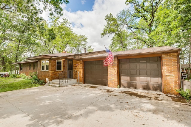 single story home with a garage