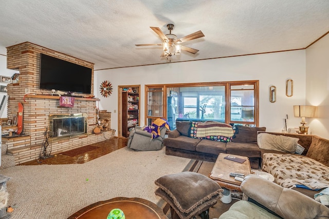 living room featuring a fireplace, a textured ceiling, and ceiling fan