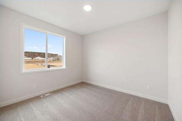 spare room featuring carpet flooring