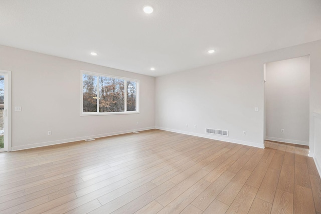 unfurnished room featuring light wood-type flooring