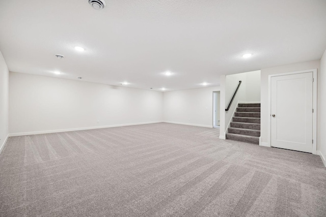 basement with light colored carpet