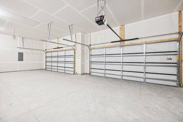 garage featuring electric panel and a garage door opener