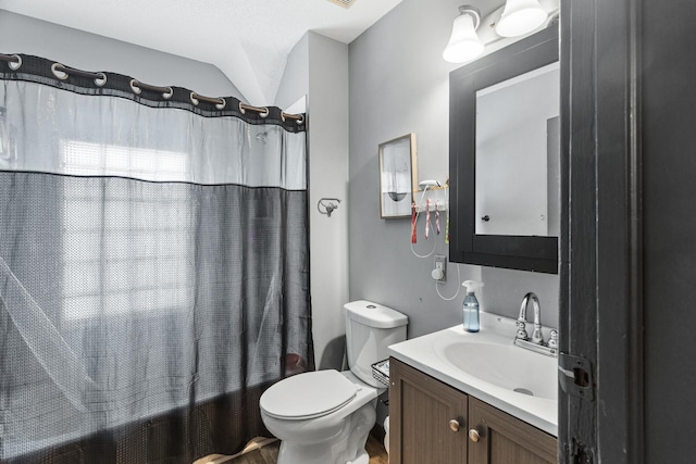 full bathroom with toilet, vanity, vaulted ceiling, and shower / bath combo with shower curtain