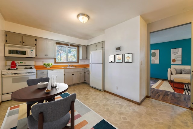 kitchen with white appliances and sink