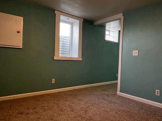 basement featuring carpet flooring and a healthy amount of sunlight