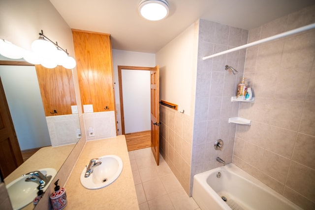 bathroom with tile patterned floors, vanity, and shower / bathtub combination