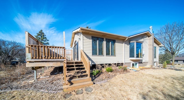 view of home's exterior featuring a deck