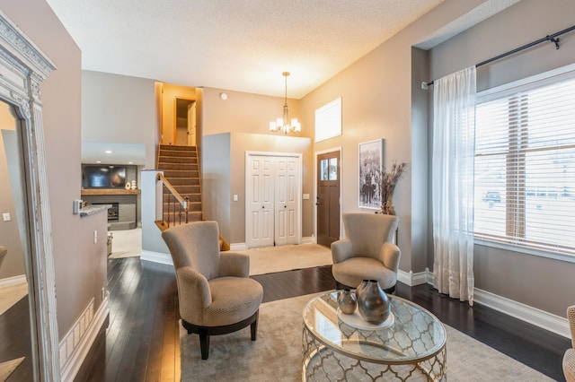 interior space with dark hardwood / wood-style flooring and a healthy amount of sunlight