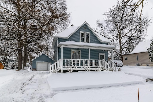 view of front of property featuring a garage and an outdoor structure