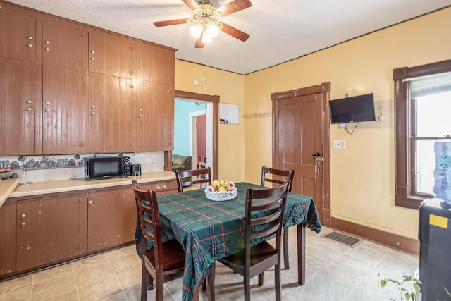 dining space with ceiling fan