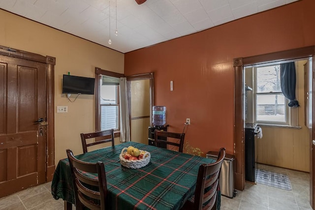 dining space featuring light tile patterned floors