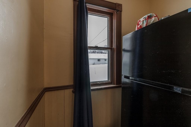 room details featuring black fridge