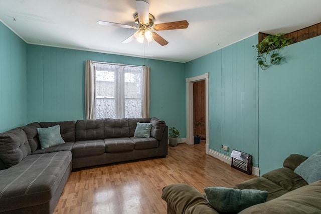 living room with ceiling fan and light wood-type flooring