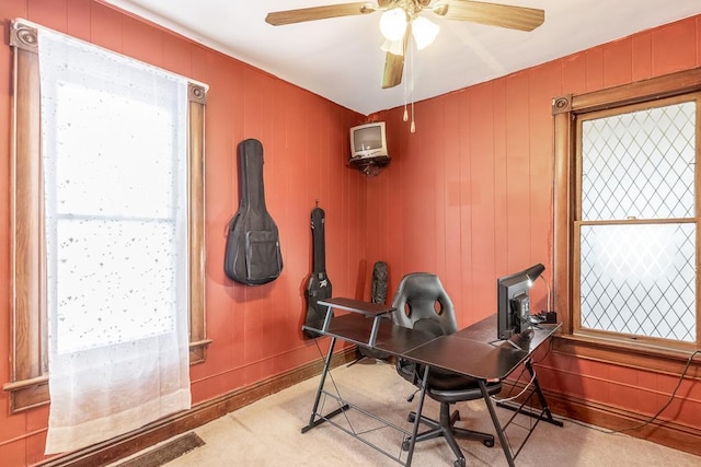 office area featuring carpet flooring, ceiling fan, and plenty of natural light