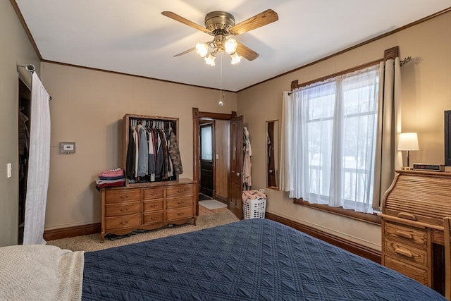 bedroom featuring light colored carpet, ceiling fan, and ornamental molding