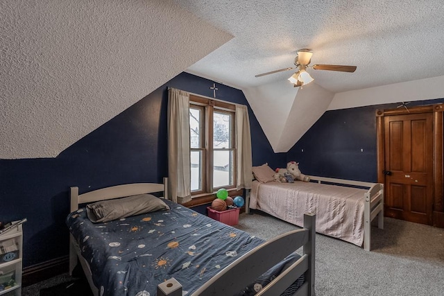 carpeted bedroom featuring a textured ceiling, ceiling fan, and lofted ceiling