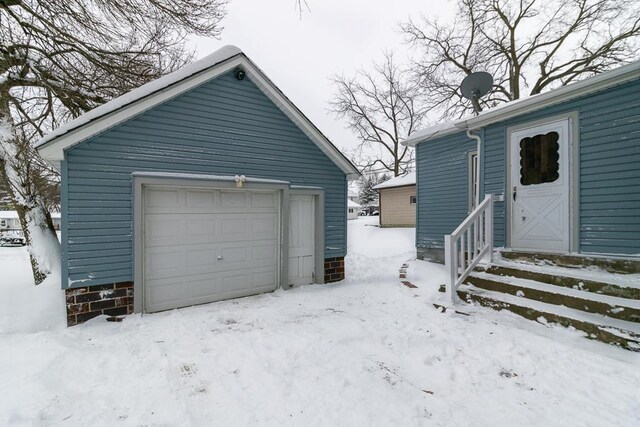 view of snow covered garage