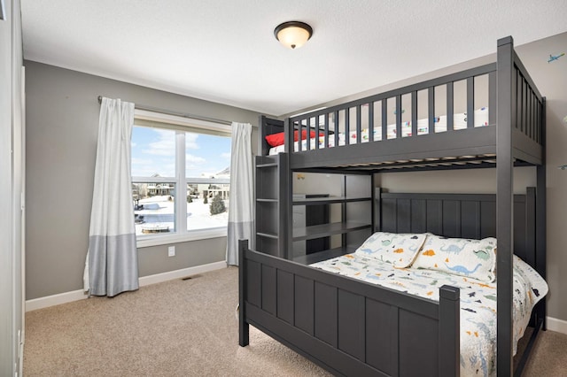 carpeted bedroom featuring a textured ceiling