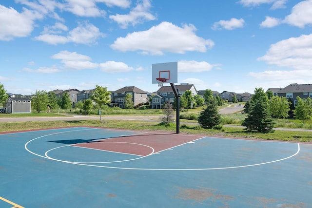 view of basketball court with community basketball court and a residential view