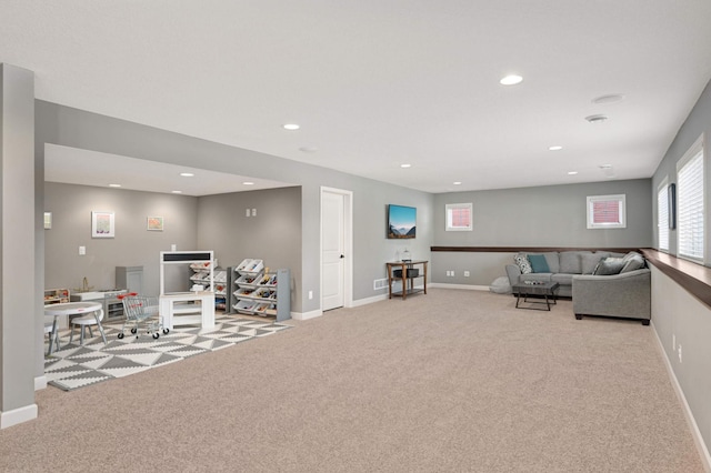 interior space with carpet, baseboards, and recessed lighting