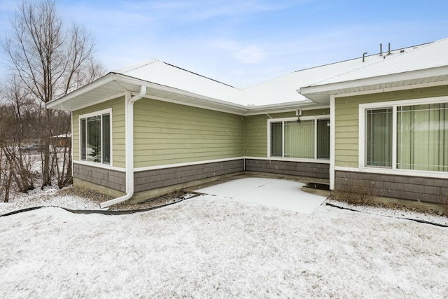 view of snow covered property