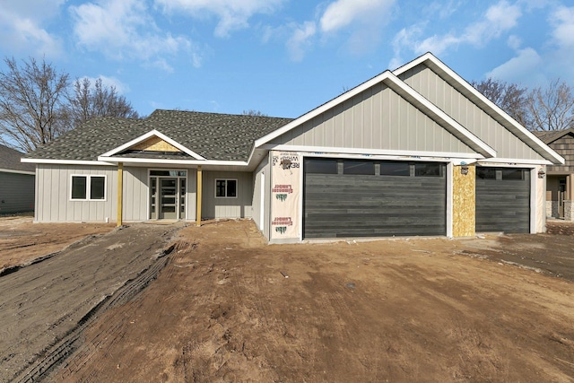 view of front of house featuring driveway and a garage